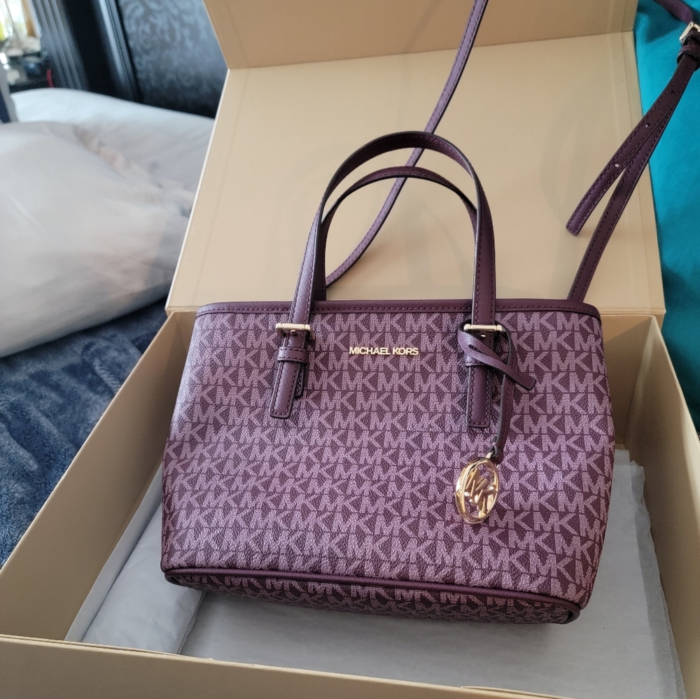 Michael Kors Purse/small over shoulder strap/burgundy color.  New never used